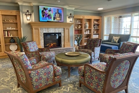 Cozy common area with comfortable seating and a fireplace