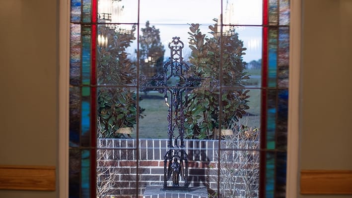 View through a stained glass window to an outdoor space