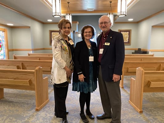 Three residents in a common area of the facility