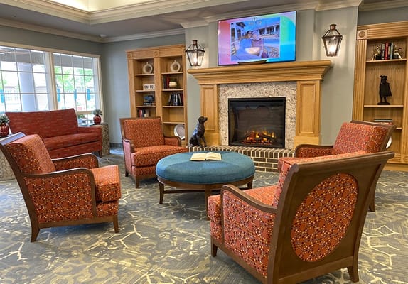 Interior common area with seating and a fireplace