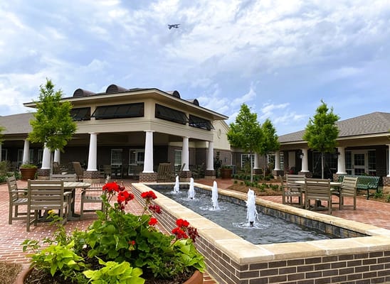 Outdoor space featuring a fountain and seating area