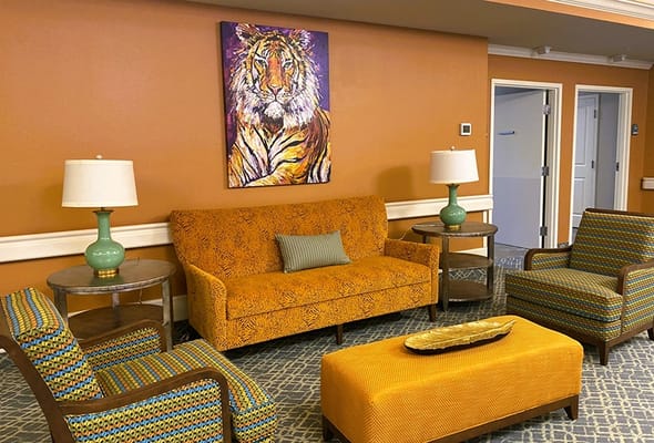 Interior common area with colorful seating and artwork