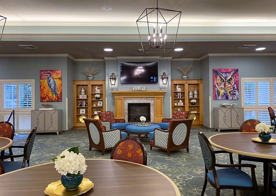 Comfortable common area with cozy seating and artwork