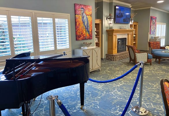Interior view of a lounge area with a piano