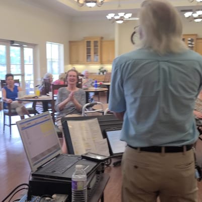 Residents enjoying a live event in a common area