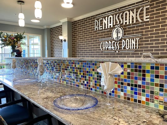 Decorative dining area with colorful tile and chairs