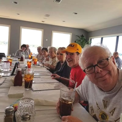 Residents enjoying a meal together in the dining room