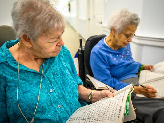 Residents engaged in a word search activity