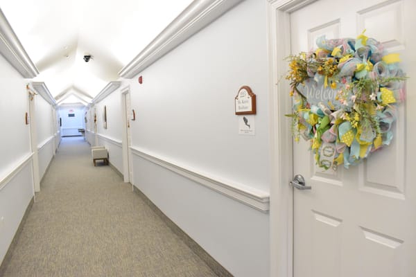 Interior hallway with a decorative wreath on a door