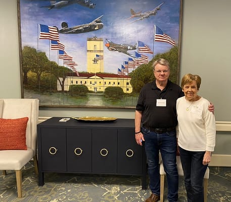 Residents posing together in a decorated common area
