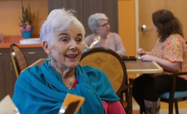 Residents enjoying time in a colorful common area