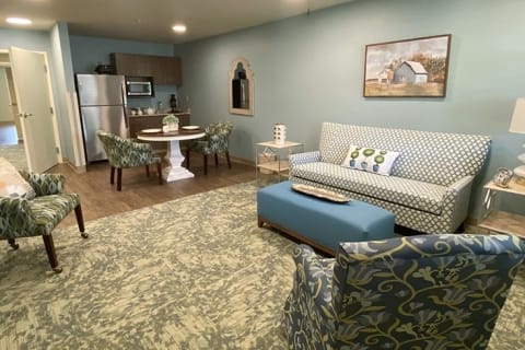 Bright interior common area with seating and kitchen