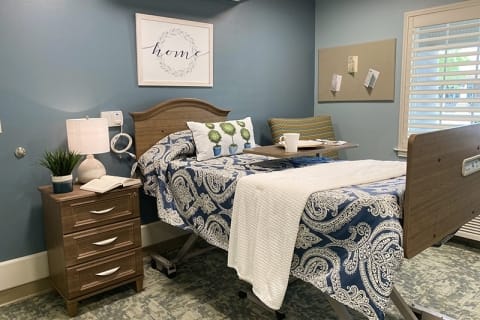 Cozy resident room with a hospital bed and decor