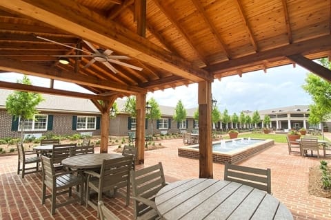 Outdoor patio area with seating and landscaping