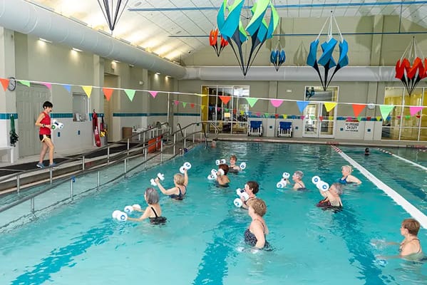 Residents participating in a water exercise class
