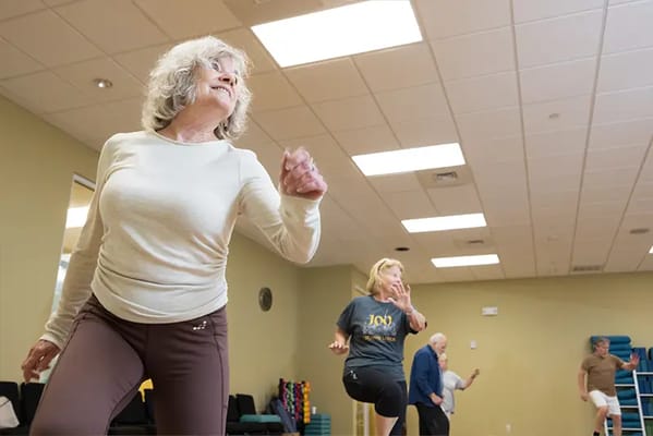 Residents engaging in a dance class