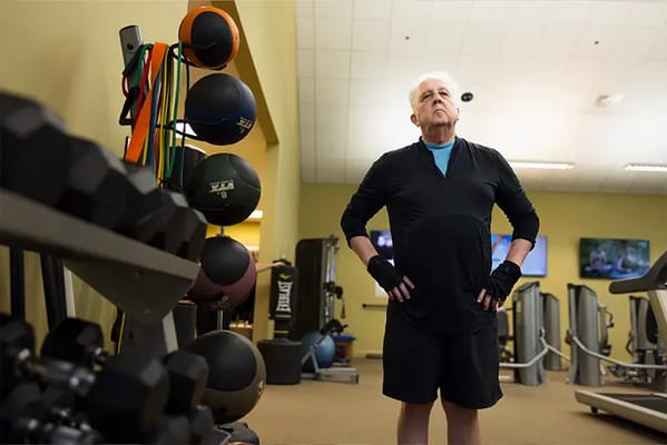 Senior resident exercising in a fitness room