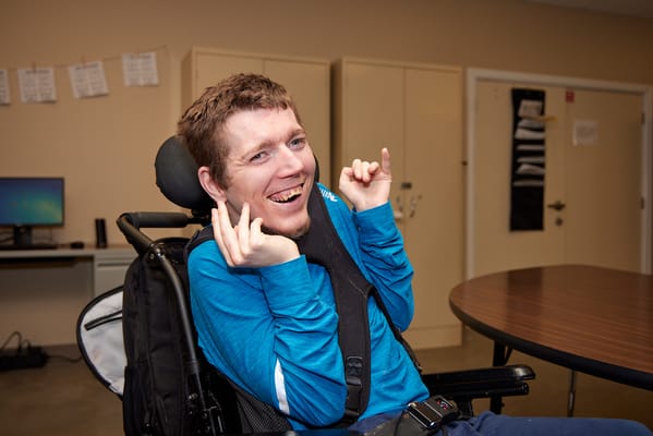 Resident enjoying a moment in the activity room