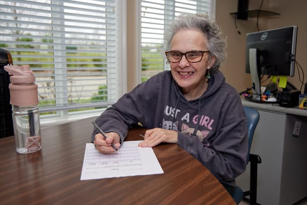 Resident engaged in an activity at a facility common area