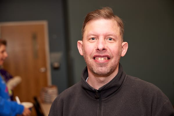 Smiling resident in a social setting