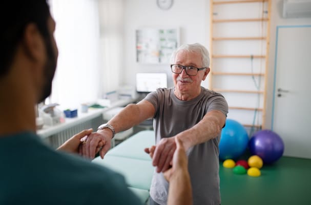 A senior man participating in physical therapy