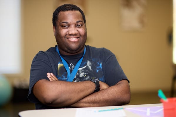 Happy resident smiling in a common area