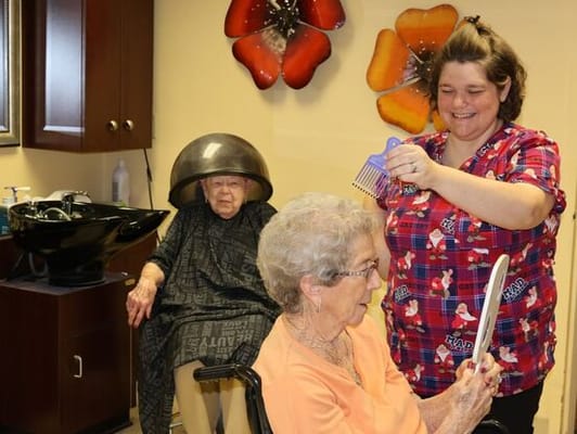 Residents receiving salon services in a facility setting