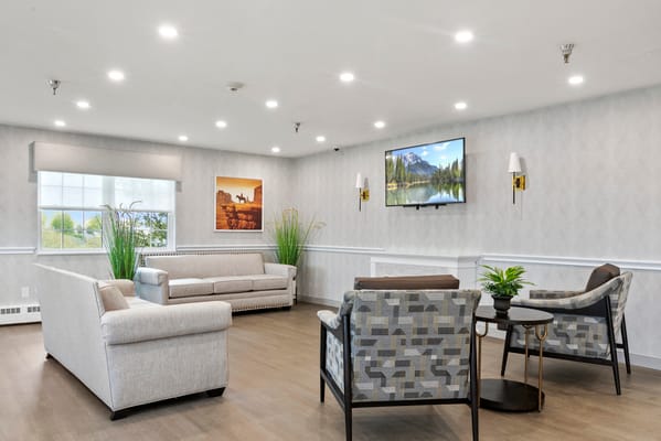 Bright common area with seating and artwork