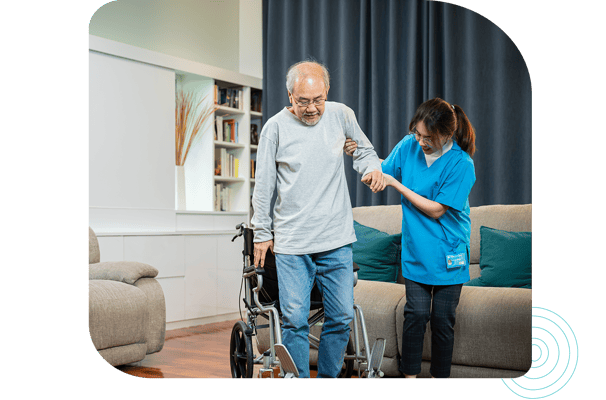 A staff member helping a resident in the facility