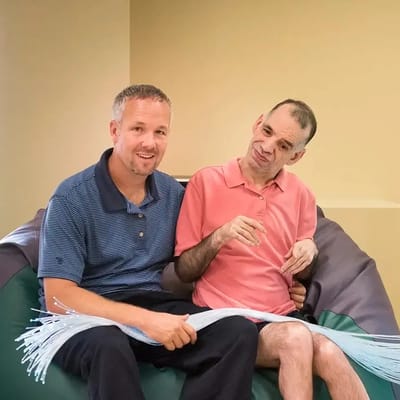 Two residents in a relaxing indoor setting