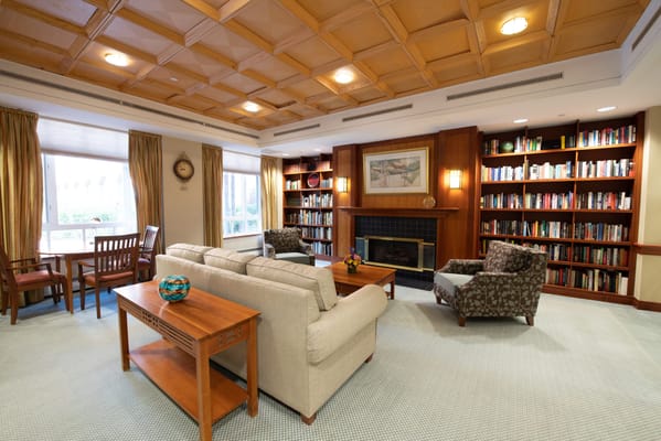 Cozy common area with bookshelves and seating