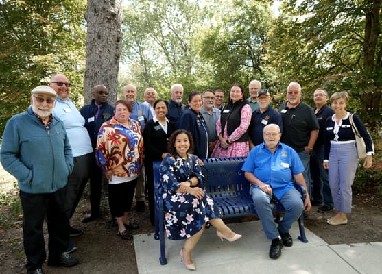 A group of residents and staff gathered outdoors