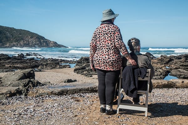 Two people enjoying a beach view together