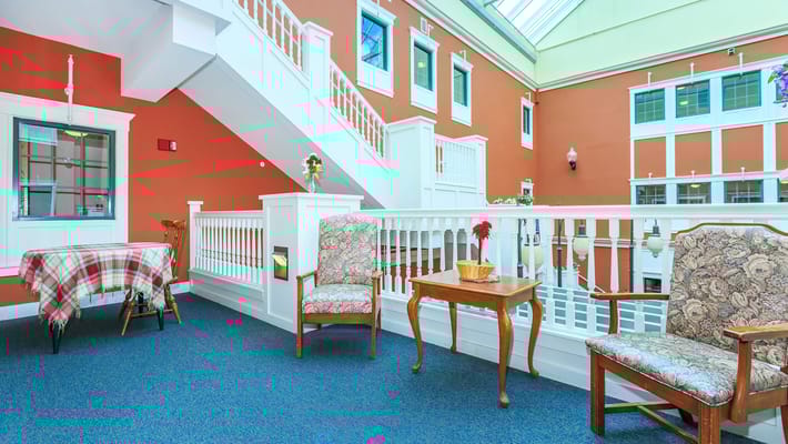 Bright common area with chairs and table