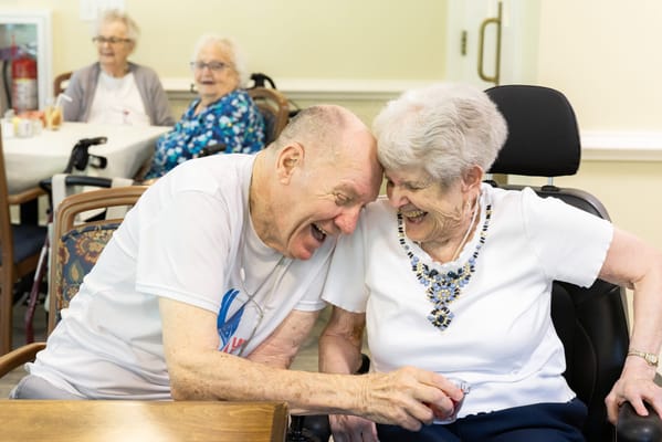 Residents enjoying a joyful moment in the activity room