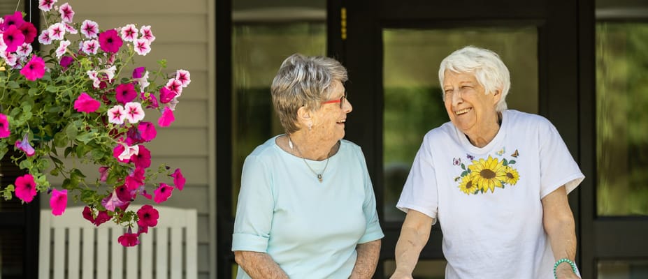 Two residents enjoying time together outdoors