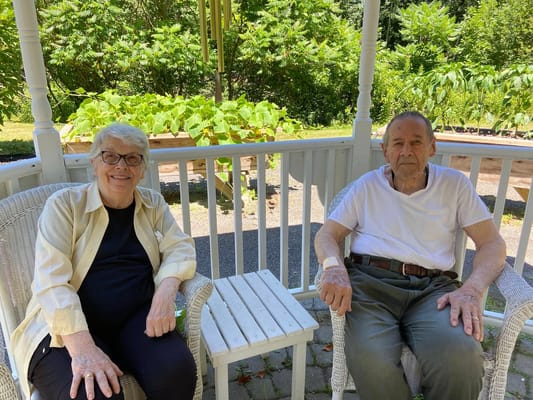Two residents enjoying the outdoors at the facility