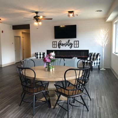Bright common area with round table and seating