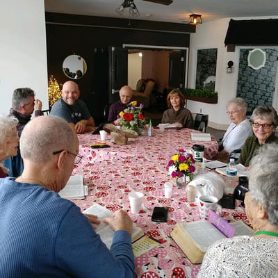 Residents engaged in a group activity around a table