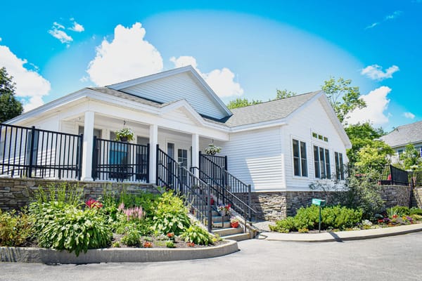 Exterior view of Bella Point Bridgton with gardens