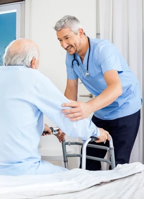 Nurse assisting a resident in a bright room