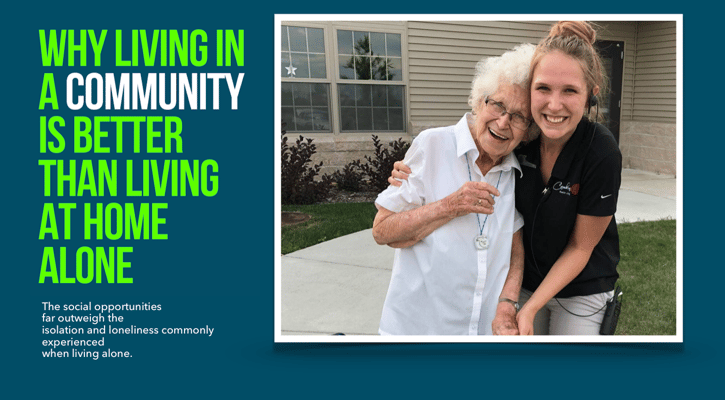 Resident and staff member smiling together outdoors