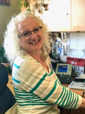 Employee smiling in an office setting