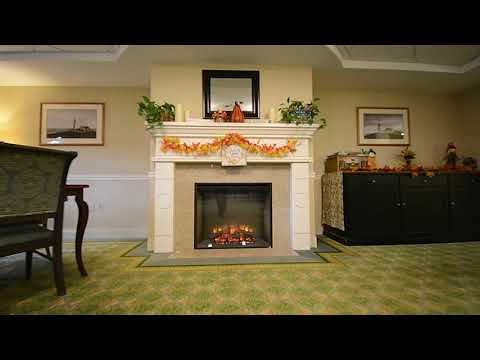 Cozy common area with a fireplace and seasonal decorations