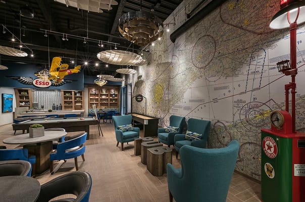 A stylish interior common area with colorful furniture and decor