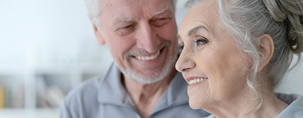 Smiling elderly couple enjoying each other's company