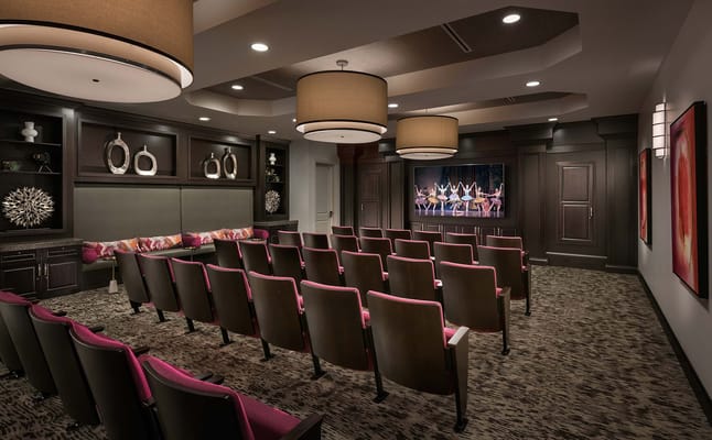 Spacious activity room with seating and large screen