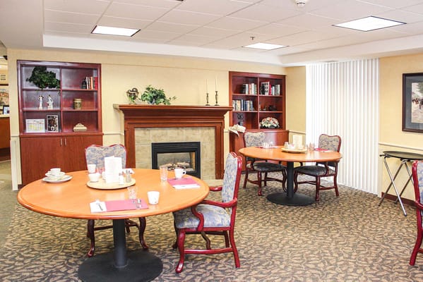 Dining area with tables and chairs in a cozy setting