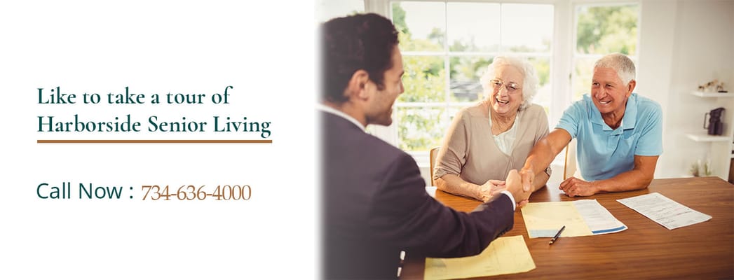 Residents discussing with staff in a welcoming common area