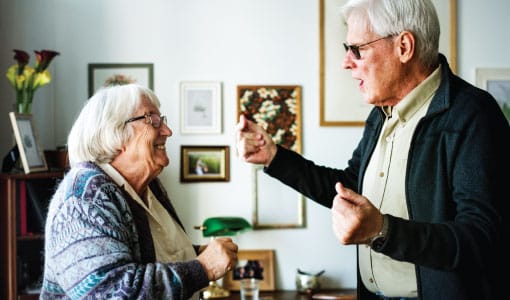 Residents enjoying a joyful conversation in a common area